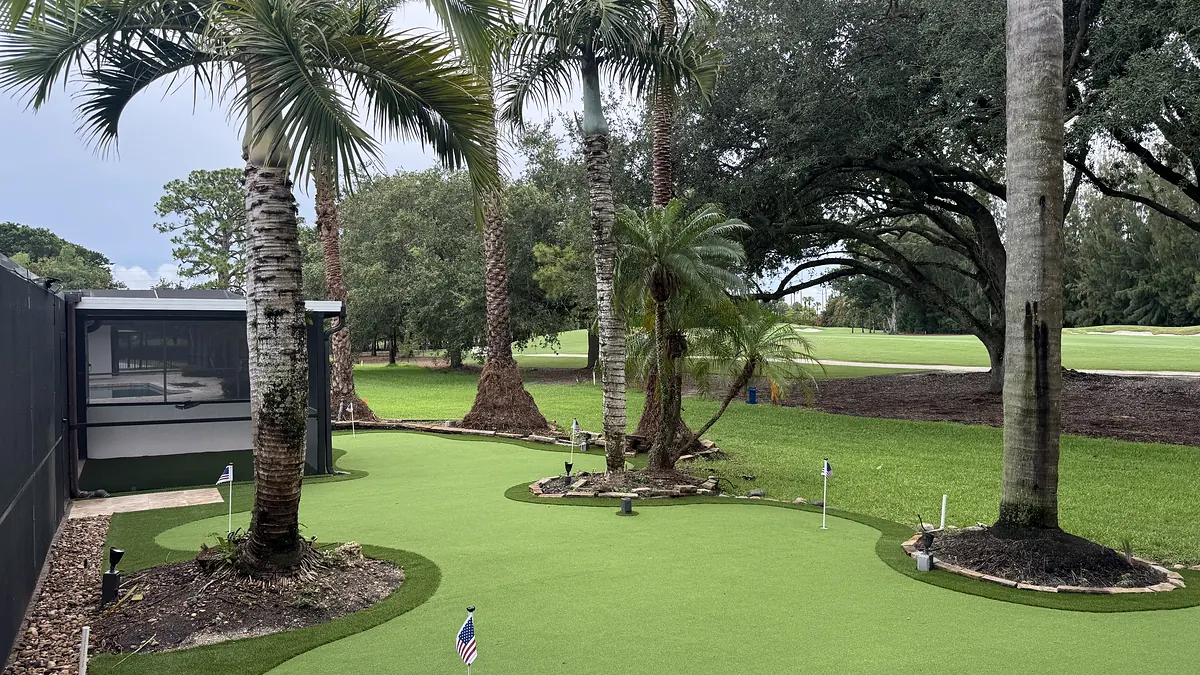 The putting green photographed on site after installation, with the surrounding beds not yet planted